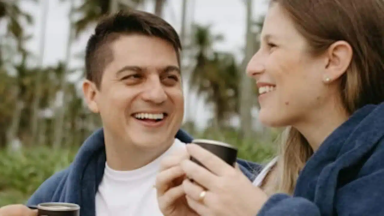 Man smiling during a lighthearted conversation